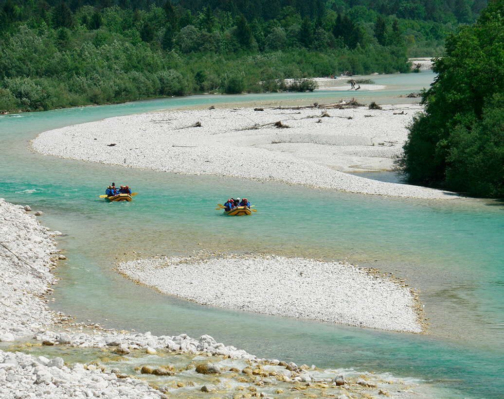 Long rafting tour also floats on a scenic section of SoLong rafting on Soča rivera river, around Bovec