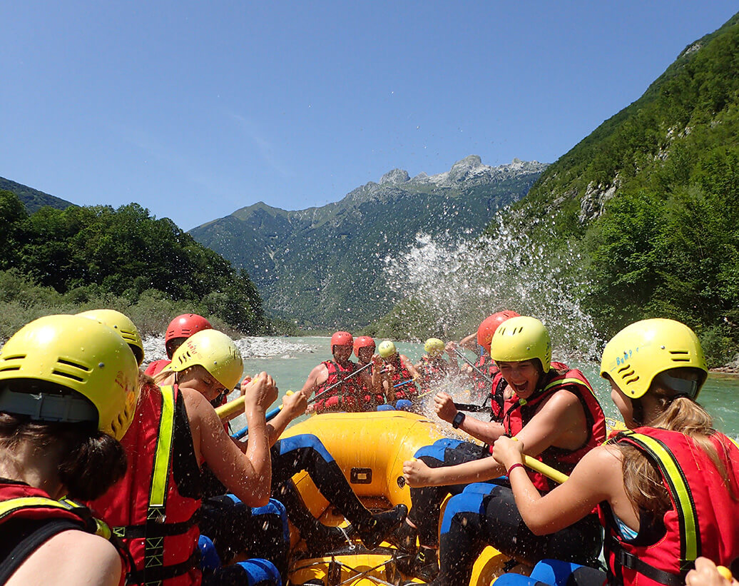 Rafting Bovec Slovenia Soča | Rafters are slpashing eachother on rafting tour, Bovec, Slovenia, Soča river