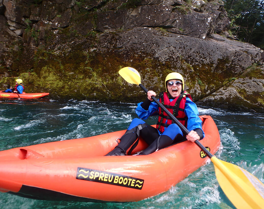 Whitewater kayak tour Bovec | Kayaker is enjoing Soča river